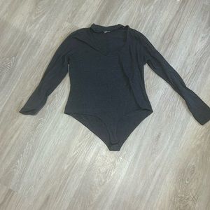 Long sleeve, high collar cut out body suit